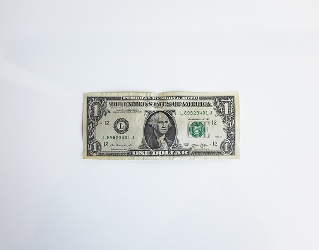 A one-dollar bill on a white background