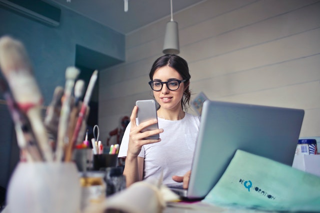 A woman looking at her phone